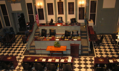 view from above looking down on raised seats in front of legislative hall